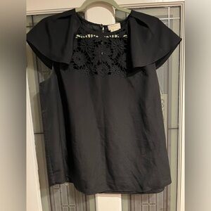 Kate spade black blouse with open eyelet flower pattern